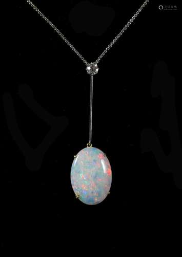 A 1920's gold, oval white opal and single stone diamond...