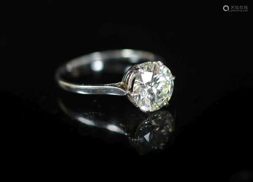 A platinum and solitaire diamond ring