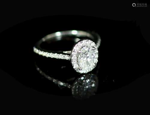 A Rox platinum and oval cut single stone diamond ring, with ...