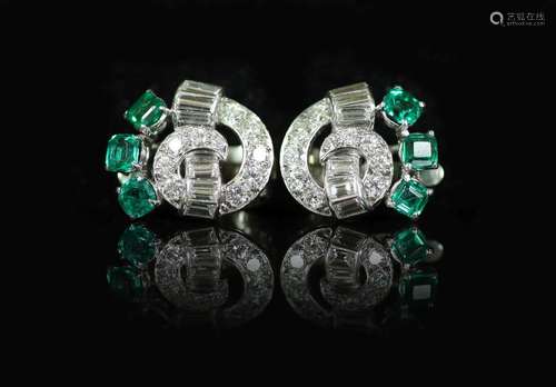 A pair of 1950's white gold, emerald and diamond cluste...