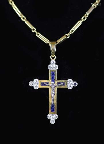 A modern 750 gold, sapphire and diamond set crucifix pendant...