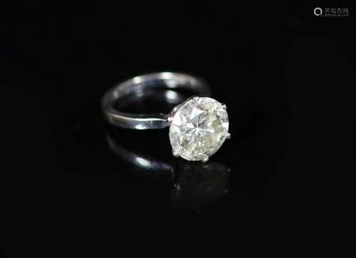 A modern 18ct white gold and solitaire diamond ring