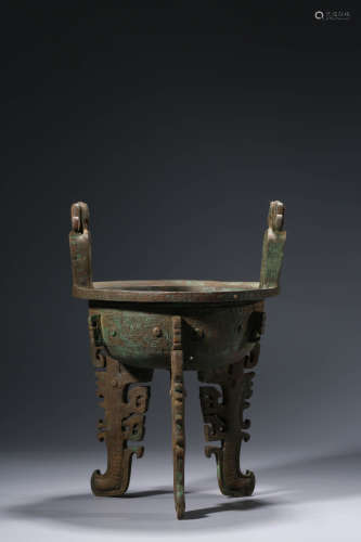 A Chinese Bronze Taotie Steaming Vessel, Ding