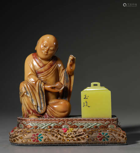 A Chinese Soapstone Luo Han Carving and A Yellow Jade Seal