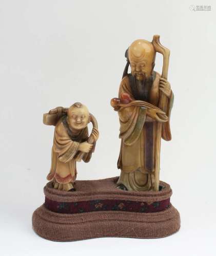 A Group of Two Soapstone Statues