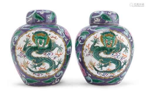 A PAIR OF CHINESE POLYCHROME ENAMELED LIDDED PORCELAIN JARS,...