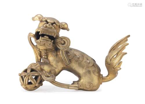 A CHINESE BRONZE SCULPTURE OF A BUDDHIST LION, FIRST HALF 20...