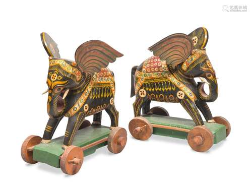 A PAIR OF THAI LAQUER WOOD TOYS IN SHAPE OF ELEPHANTS. EARLY...