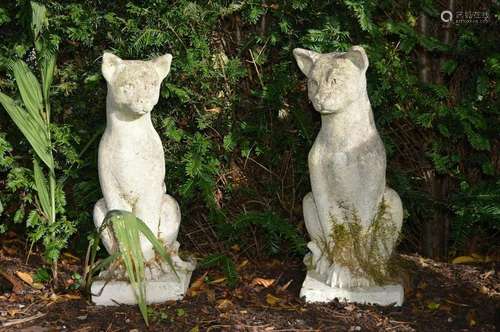 PAIR OF MOULDED STONE GARDEN SCULPTURES