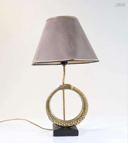 Vintage lamp decorated with a snake biting its tail in