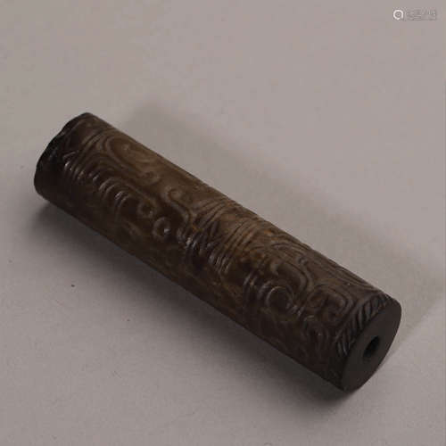 A Carved Brownish Jade Dragon Tube