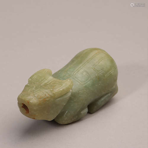 A Carved Celadon Jade Figure of Bull