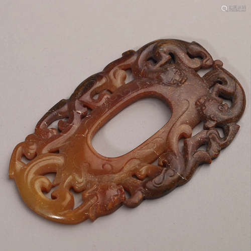 A Carved Brownish Jade Dragon Pendant