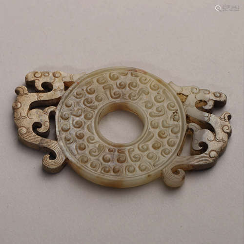 A Carved Celadon Jade Dragon and Phoenix Disc Bi