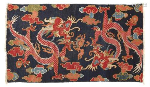 A fragment of a Tibetan wool dragon rug. Early 20th century