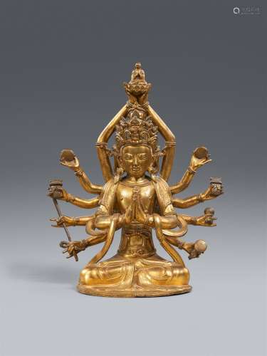A fire-gilt bronze figure of a twelve-armed and four-headed ...