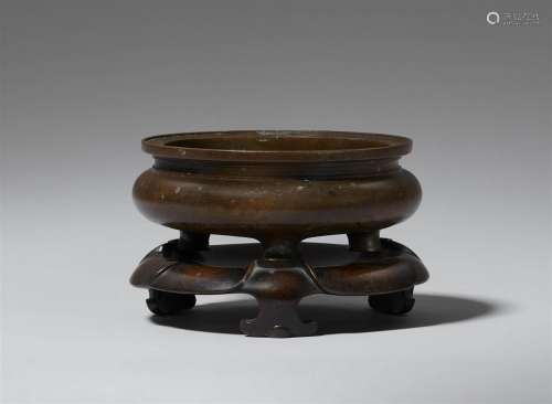 A bronze incense burner and stand. Qing dynasty, possibly 18...