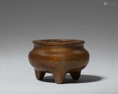 A heavy copper-coloured bronze incense burner. Qing dynasty,...
