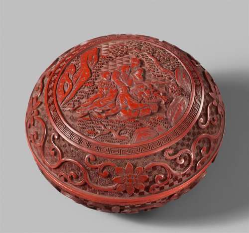A round carved red lacquer box. 19th century