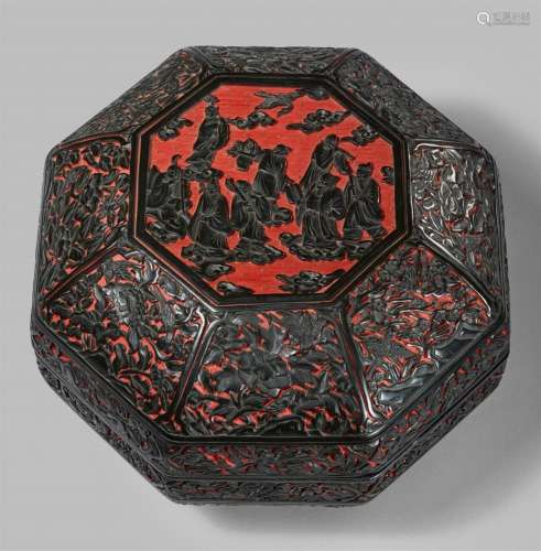 A large black carved lacquer octagonal lidded box. 20th cent...