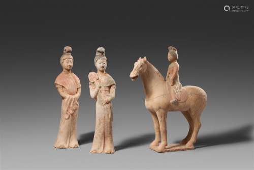 Two pottery figures of court ladies and a female equestrian....