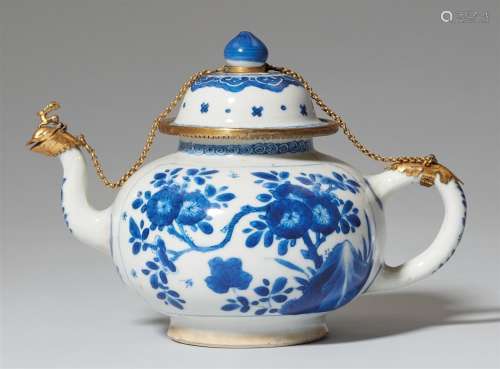 A blue and white gilt-mounted teapot and cover. Kangxi perio...