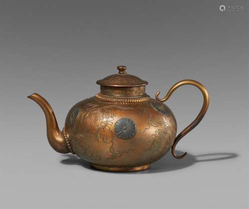 A small silver and metal tea pot. Late 19th century