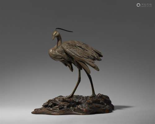A partly silvered bronze figure of a heron. Late 19th centur...