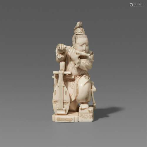 An ivory okimono of a courtier playing the flute. Late 19th ...