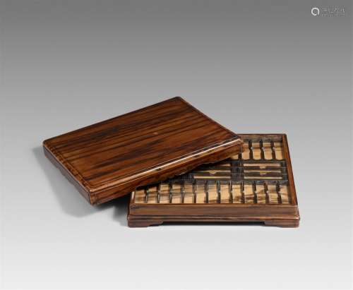 A kaki wood box for a collection of kozuka