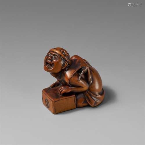 A boxwood netsuke of a luckless rat catcher. 19th century