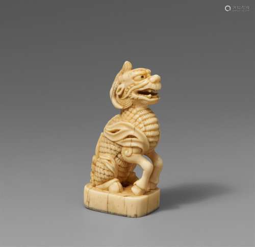 A large ivory seal netsuke of a kirin. 19th century