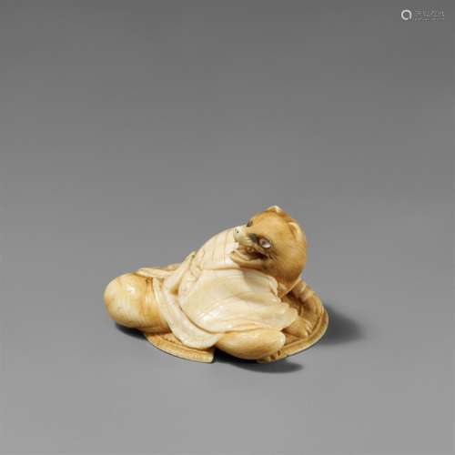 An ivory netsuke of a tanuki and a sedge hat. Second half 19...