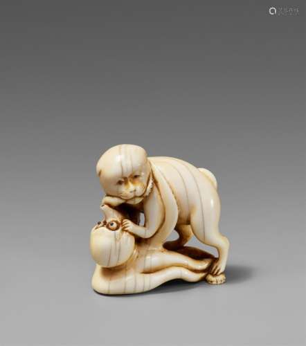 An ivory netsuke of a dog and an octopus. 19th century