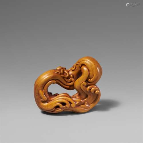 A boxwood netsuke entitled "Oceanlines", by Leigh ...