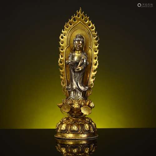 Silver Buddha statue with copper-gilded backlit base