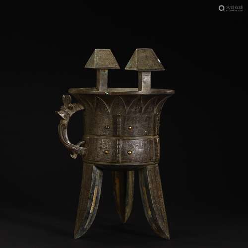 Bronze three-legged wine warming vessel