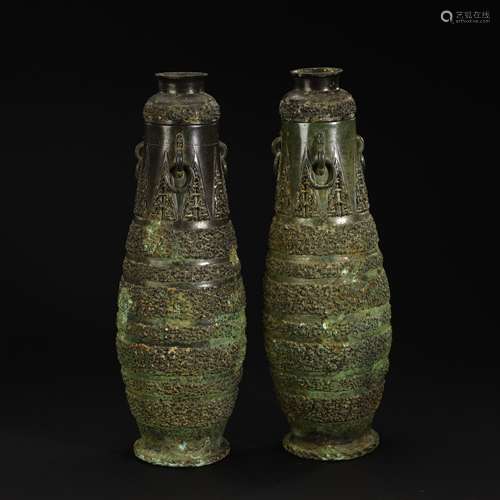 A pair of ancient bronze three-ring vessels