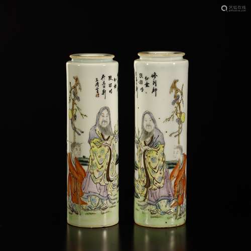 A pair of pastel figure bottles