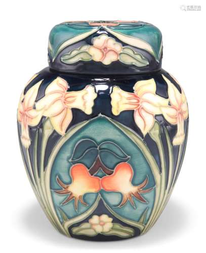 A MOORCROFT POTTERY GINGER JAR AND COVER, tubelined and hand...
