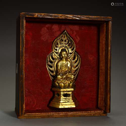 Ancient bronze-gilded Buddha statue