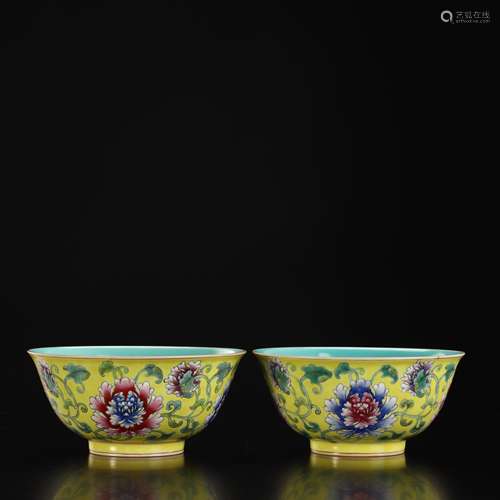 A pair of pastel yellow flower bowls