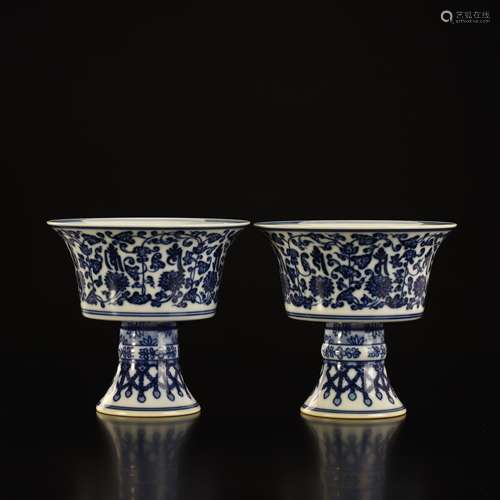 A pair of blue and white Sanskrit flowers with high feet cup...