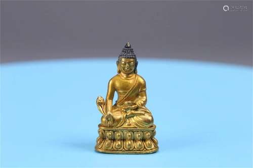 A Chinese Gilt Bronze Medicine Buddha Statue