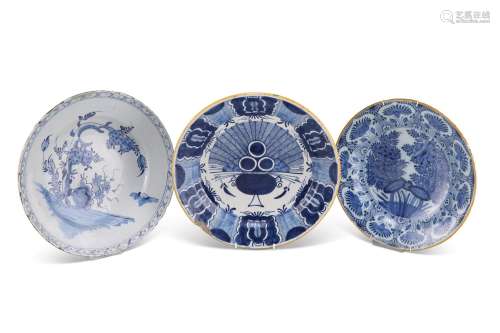 THREE 18TH CENTURY DELFT BLUE AND WHITE DISHES, circular, in...