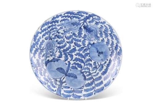 A CHINESE BLUE AND WHITE CHARGER, painted with pomegranates ...