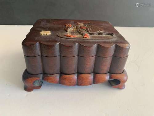 Chinese wood box on stand.