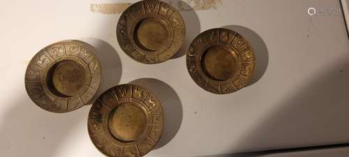 Four brass Zodiac trays Each apx. 5” diameter