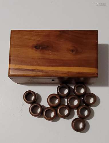 Wooden box with 11 wood napkin rings