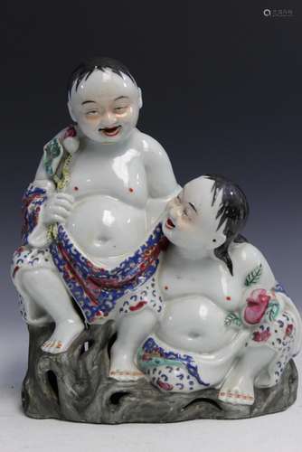 Chinese famille rose porcelain statue of two boys.